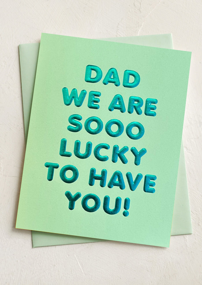 A card reading "Dad we are sooo lucky to have you!".
