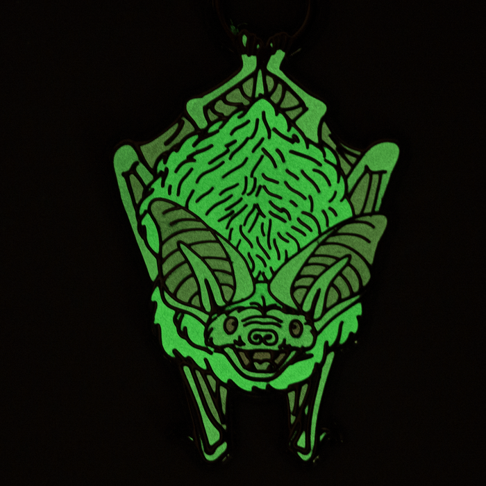 Bat ornament glowing green in the dark.