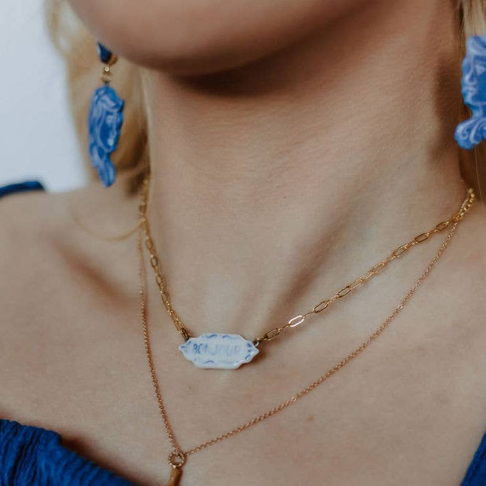 Crown & Heart zz.Bonjour pendant necklace featuring a delicate gold chain and a charming Bonjour pendant for women's jewelry.