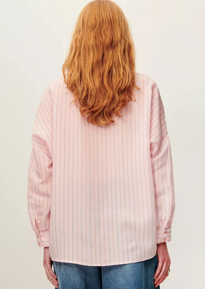 A button front shirt in pink with fine multicolor pinstripe pattern.