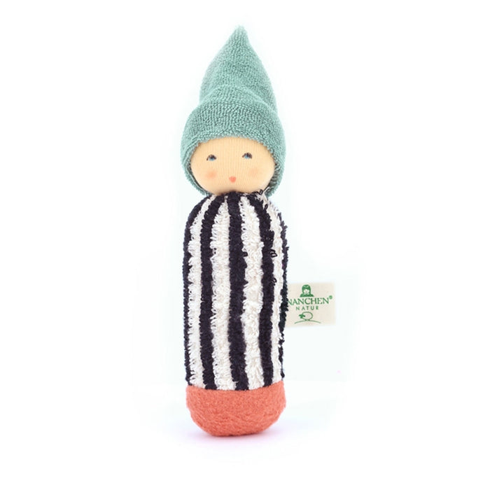 Small rattle doll with a striped outfit and green hat on a white background