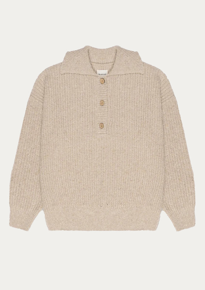 Beige knitted sweater with button details on a white background