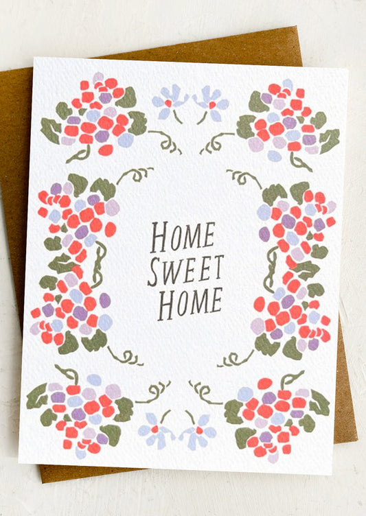 Greeting card with floral design and 'Home Sweet Home' text on a white background