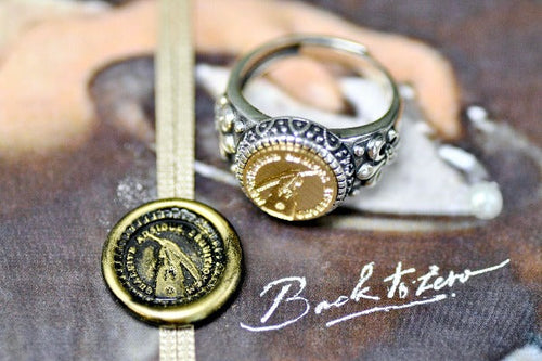 Hand Holding Feather Pen Latin Motto Fleur De Lis Signet Ring - Backtozero B20 - 12f, 12mm, 12mm ring, 925 Silver, accessory, Fleur de Lis, him, Intaglio, Intaglio ring, jewelry, knowledge, latin, latin motto, learn, Message, ring, seal, seal ring, signet, size 10, size 11, size 8, size 9, wax seal, wax seal stamp, wisdom