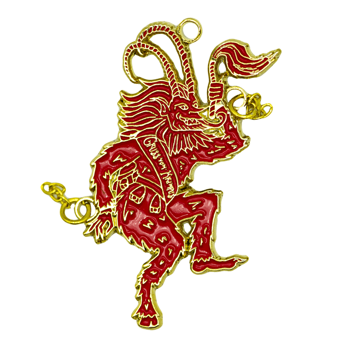 A red and gold ornament of Krampus sticking his tongue out and flailing his chains as he dances. He wears a sash that reads "Gross Vom Krampus".