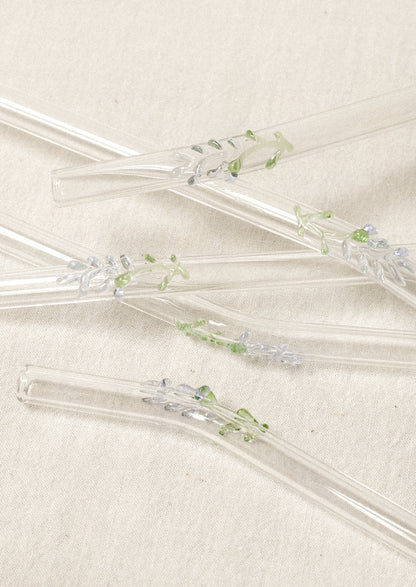 Clear glass straws with bent shape, with lampwork lavender figurine.