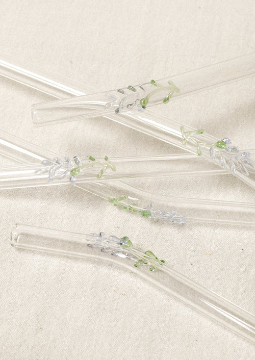 Clear glass straws with bent shape, with lampwork lavender figurine.