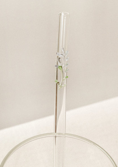 Clear glass straw with bent shape, with lampwork lavender figurine.