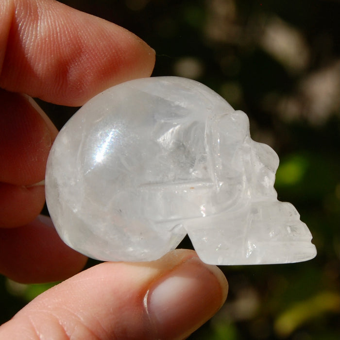 ONE 1.5" Clear Quartz Crystal Skull, Primitive Style Carving