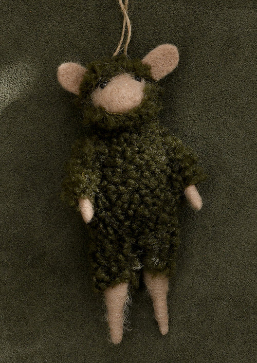 A felted animal ornament wearing fuzzy green fleece onesie.