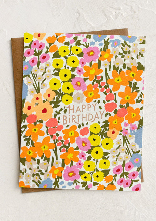 Floral birthday card with colorful flowers and 'Happy Birthday' text on a white background.
