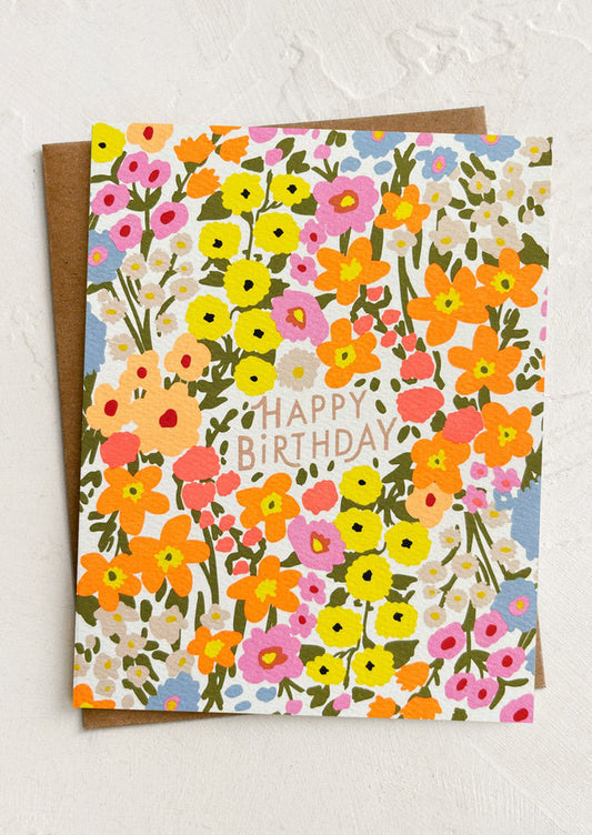 Floral birthday card with colorful flowers and 'Happy Birthday' text on a white background.