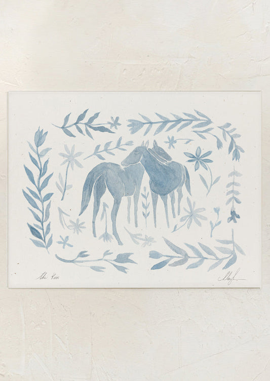 An art print of watercolor painting of two horses surrounded by floral frame in light blue.