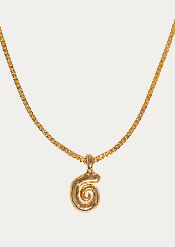Gold spiral pendant necklace on a white background